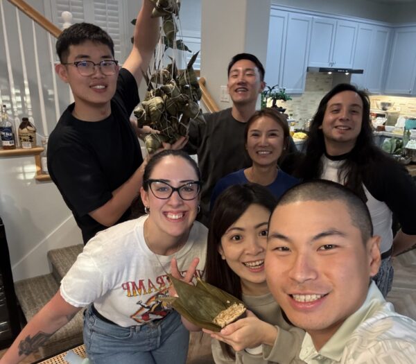 Friends posing for a picture in the living room.