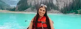 woman smiling in beautiful lake