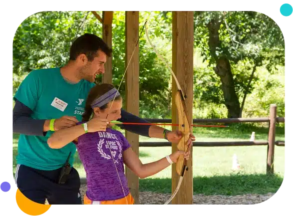 Camp Counselor Participant - teaching kid archery