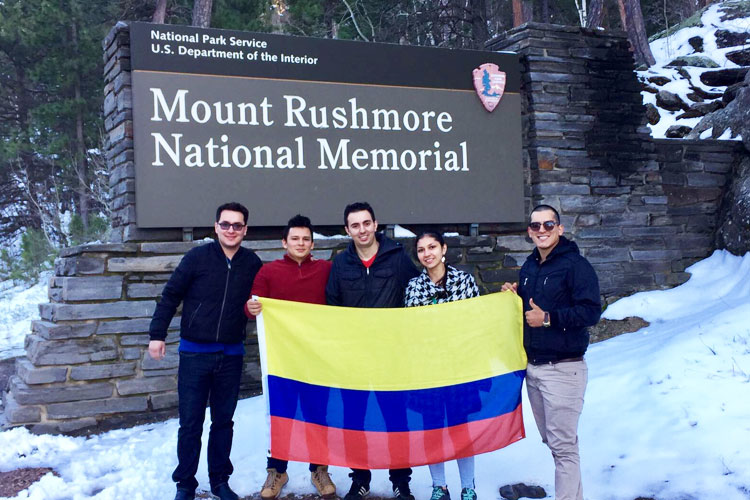 Host employer Jesus Roman and Colombian students embrace the cold.