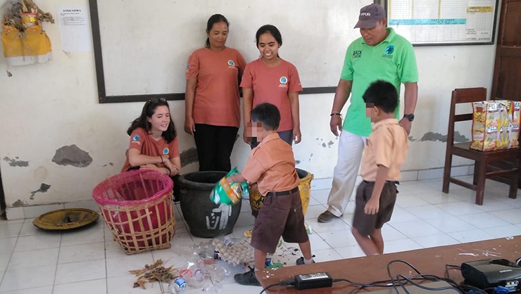 Modeling activity to show students how to sort recyclable and non-recyclable waste