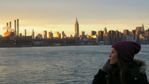 Mirela watches the NYC sunset, reflecting on her time in the U.S.
