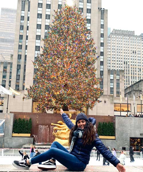 Alice in Rockefeller Center with Christmas Tree. Image courtesy of Alice F.
