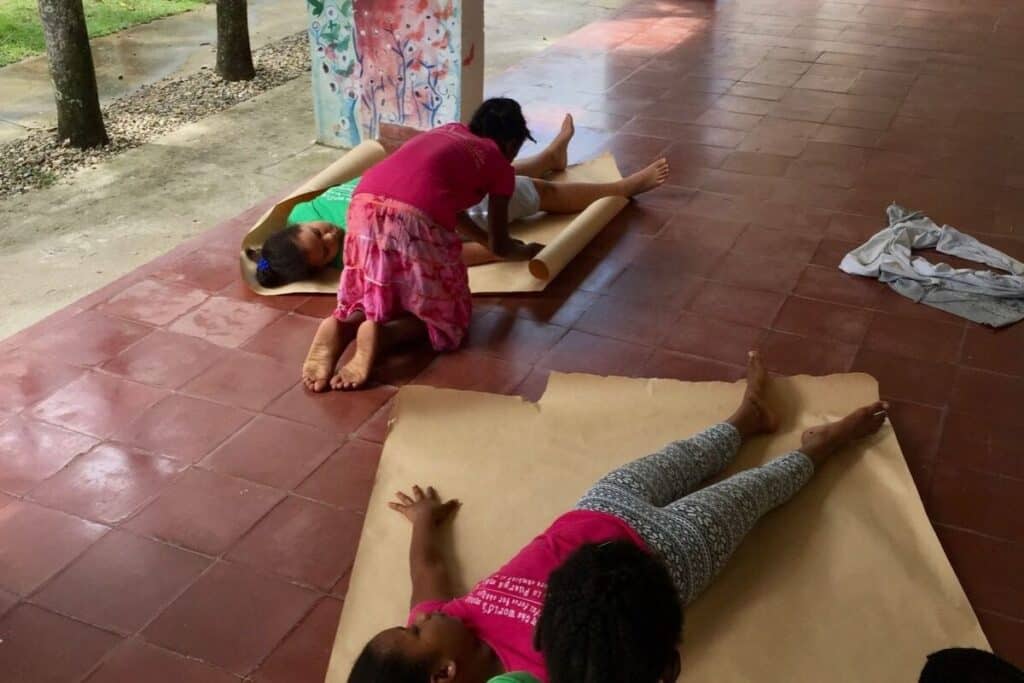 Students participating in a menstruation workshop activity.