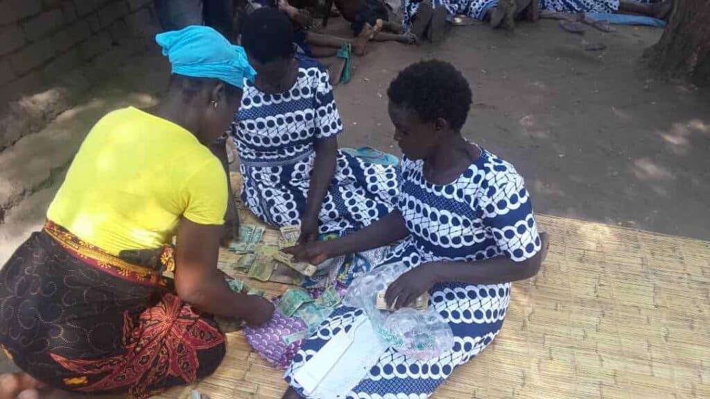 Sorting money from livestock and bicycle taxi programs to distribute to each group member