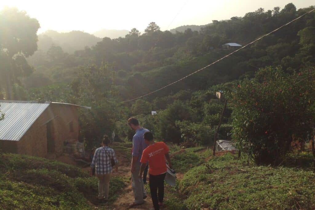 Community health care works visiting patient homes in rural Chiapas.