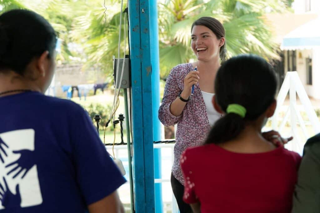 Leading a team-building exercise during a training for community healthcare workers.