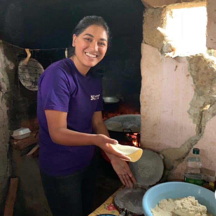 Women in the communities wake up early to make tortillas. I try my hand at it!