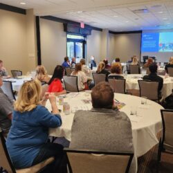 Work & Travel USA form attendees watching a presentation