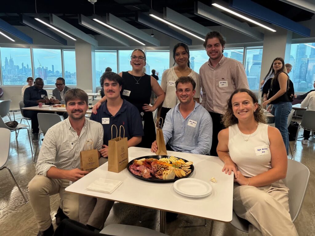 Group of young adults posing at networking event