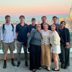 Group of young adults posing during sunset