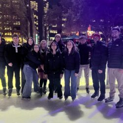 Group of several adults ice-skating