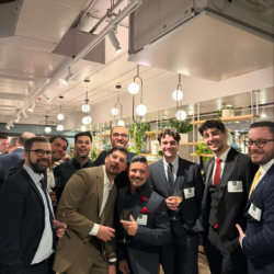Group of coworkers posing in suits