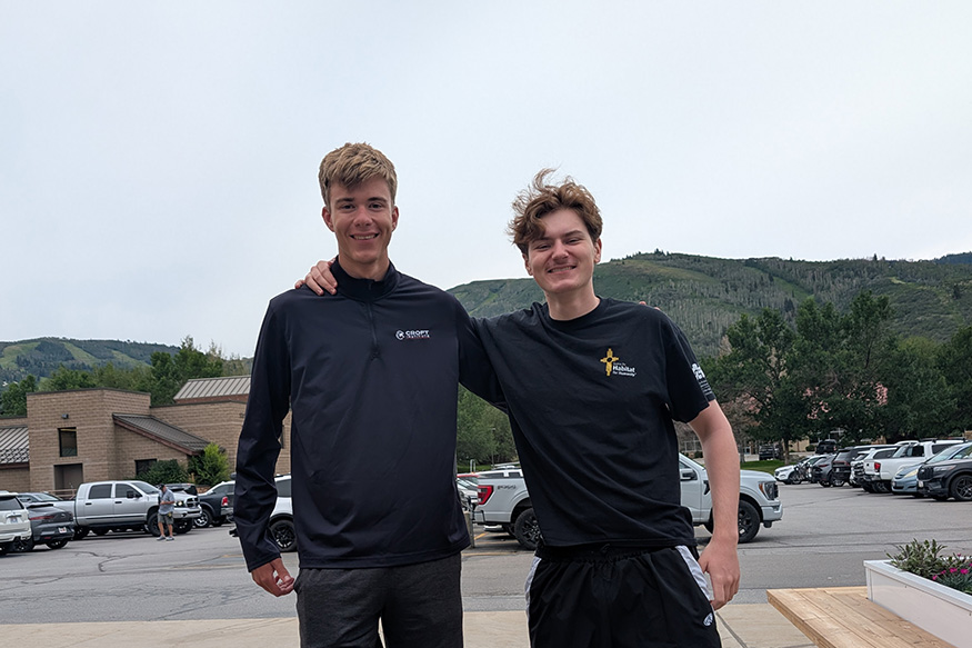 Two young men pose at the Stein Eriksen Lodge in Park City, Utah.